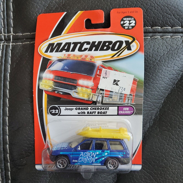 MATCHBOX 22 of 75 Blue JEEP GRAND CHEROKEE with RAFT BOAT BLUE "ACTION CANYON"